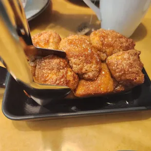 a plate of fried doughnuts
