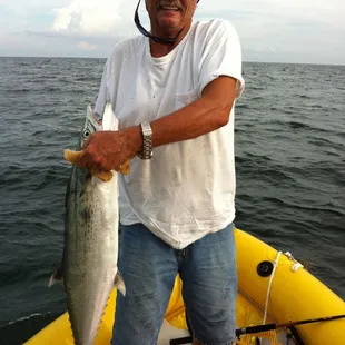a man holding a fish