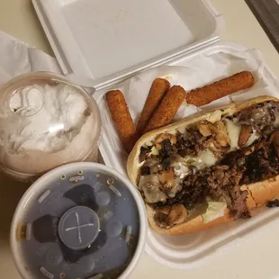Cheesesteak, mozzarella sticks, milkshake, and a coke. Uber eats delivered wrong order but it was good. Had to microwave.