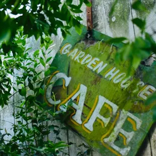Little sign in middle of trees