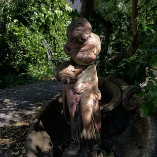 a statue of a fish in a pot