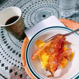 Americano; eggs, bacon and cheese; water.