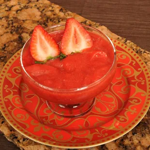 strawberries in a bowl on a saucer