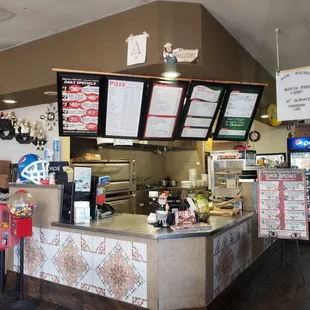 the counter and menus of the restaurant