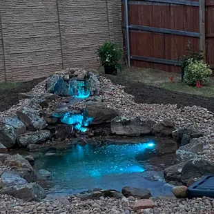 Night view of my garden pond with lights.