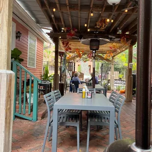 a patio with a table and chairs