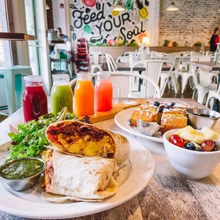 a plate of food and a bowl of fruit