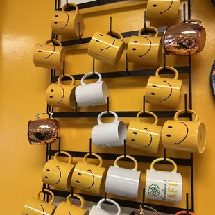 a rack of coffee mugs