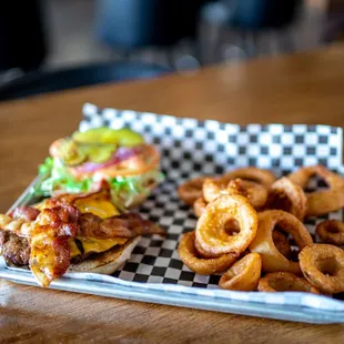 a burger and onion rings