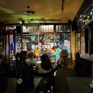 a group of people sitting in a bar