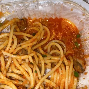 a pan of spaghetti and meat