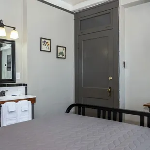 Prefer privacy but want to save? Try our hotel-hostel hybrid rooms! Full Bed w/Shared Hall Bathroom.  Sinks in room