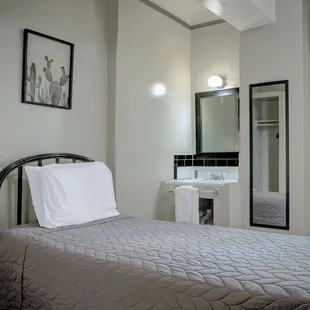 Twin Bed w/Shared Hall Bathroom
Prefer privacy but want to save? Try our hotel-hostel hybrid rooms! Sink in room