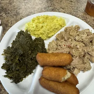 Pork Barbecue Plate. Can greens &amp; Coleslaw with mustard in it. Dry bar b q and frozen hush puppies. The best thing was the sweeeeeeet tea.