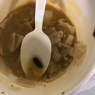 a bowl of soup with a spoon in it
