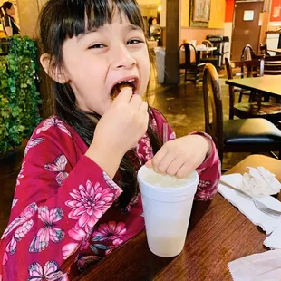 Enjoying chips, salsa and guacamole with a lemonade