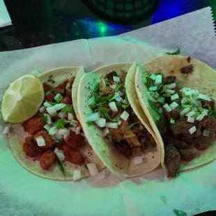 three tacos on a table