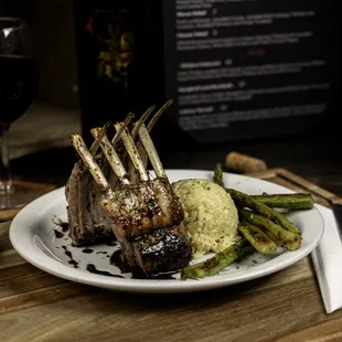 a plate of food and a glass of wine