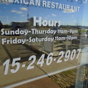 Hours of operation, front entry door.