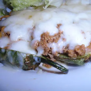 Baked jalapenos &amp; ground beef, close-up.