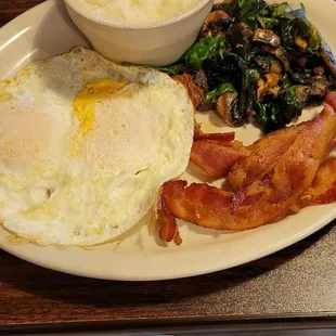 A la cart items. Grits, eggs, bacon with spinach and mushrooms.