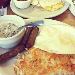 Eggs, sausage, hash browns, sausage gravy, and a breakfast taco oh my!!!