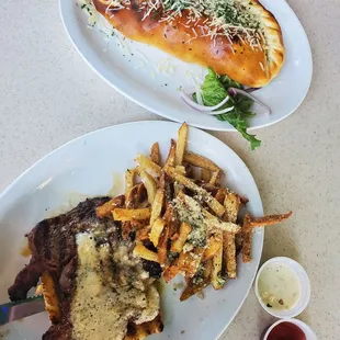 Garlic steak open face sandwich and a calzone