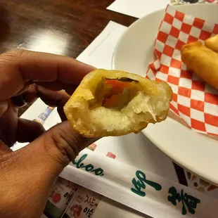 The inside of the veggie Spring Rolls (carrots, onion, cabbage, and green onion)