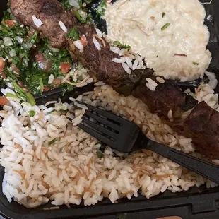 Beef kebab plate, with tabouli baba ghanouj and rice pilaf. It came with two skewers just forgot to take a picture before I started eating.