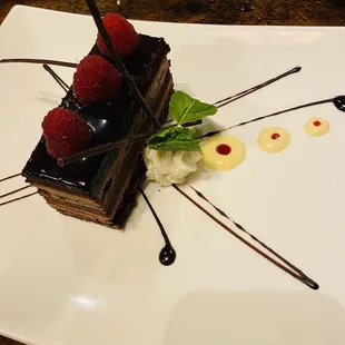 a chocolate dessert with raspberries