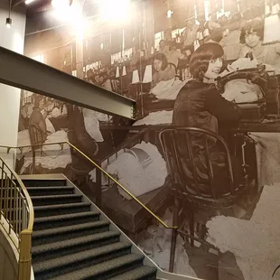 full wall mural photo going up the stairs to the 2nd floor