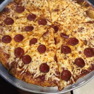 Half pepperoni half cheese pizza