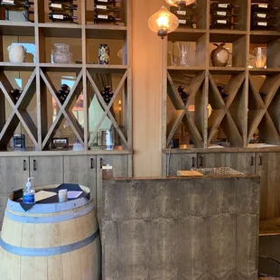 a wooden bar with a wine rack