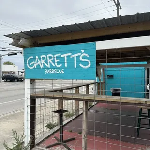 Outside small spot with gravel parking lot.