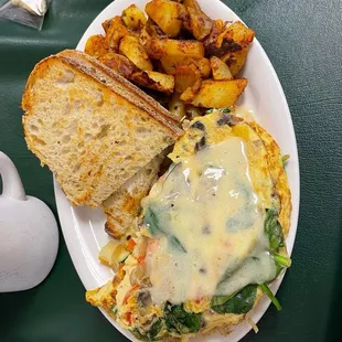 Veggie omelette with cheddar cheese and homemade hashbrowns