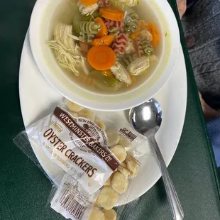 Fresh homemade chicken soup. He cooks the noodles fresh to order with each bowl and adds.