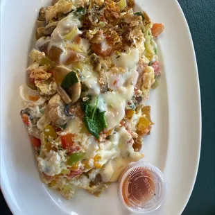 Veggie egg white omelette with extra veggies and jalapeños.