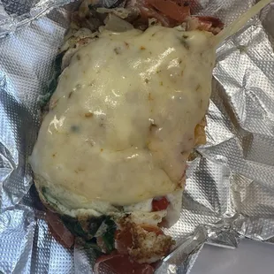 Egg white veggie omelette with pepper jack cheese cooked in olive oil absolutely amazing.