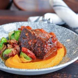 a plate of food on a wooden table