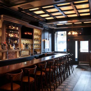 a bar with wooden bar stools