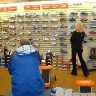 Customers searching the racks and waiting to be fitted (there was a long line that day.)