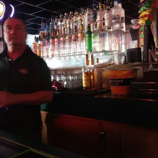 a bartender behind the bar