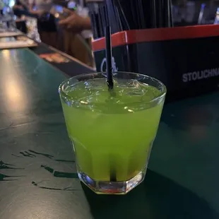 a green drink in a glass