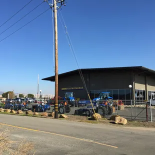 Our latest location at 4088 Russell Rd Fairfield! New Holland tractors out front on our opening day.