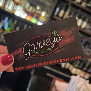a person holding a business card
