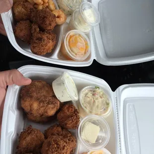 popcorn shrimp dinner and 2 crab cakes dinner.  both dinners with coleslaw, 4 hushpuppies, fruit cocktail, butter and tartar sauce.
