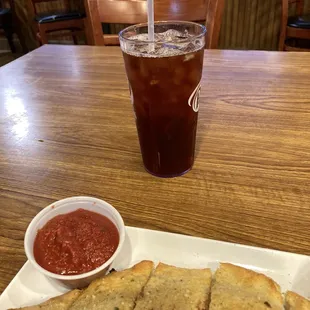 view of my weak iced tea and calzone