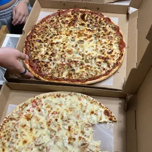 three pizzas in boxes