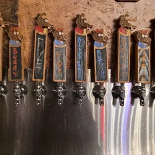 a row of beer taps