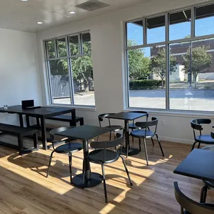 empty tables and chairs in a coffee shop